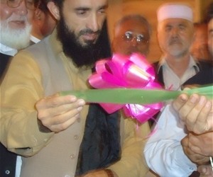 The deputy of Nangarhar provincial council (center) and other government representatives cut the ribbon to open the Jalalabad Ci