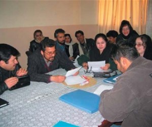 Budding playwrights review their scripts at the USAID Writing for Radio Workshop in Kabul.