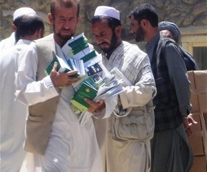 Community Cultural Center volunteers distribute information about access to justice, legal rights, and women's rights in Parwan 