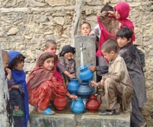 Children in Nawa village in Kunar province collect water from a new tap installed by USAID.
