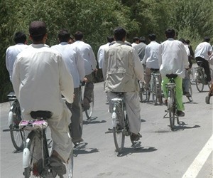 Every day over 400 bicyclists ride over the Pul-e-Alam road south of Kabul. Many of the riders are students going to-and-from sc