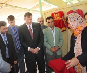 Acting Minister of Agriculture, Irrigation and Livestock Saleem Khan Kunduzi and U.S. Ambassador Karl Eikenberry visit the booth