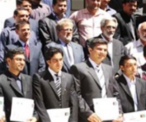 New managers at the Herat Medium Taxpayer Office display their certificates after completing a USAID-funded management training 