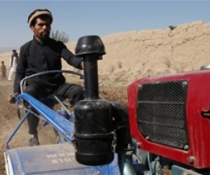 Shah Mohammed demonstrates his family’s new two-wheel tractor. The tractor will enable Mohammed and his five brothers to cultiva