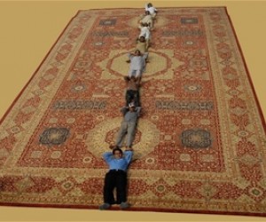 Afghan carpet makers enjoying their time at Domotex 2010.