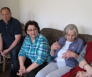 Tenants of Tesanj in Bosnia and Herzegovina converse comfortably inside a warm apartment.