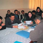 Budding playwrights review their scripts at the USAID Writing for Radio Workshop in Kabul.