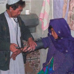 A young woman receives treatment at a USAID-funded Basic Health Center in Bamyan Province, Afghanistan.