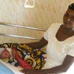 Women and Baby rest in hospital room
