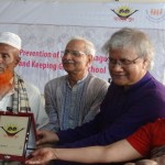 Abdul Majid, second from left, is recognized for his commitment to educating his three daughters.