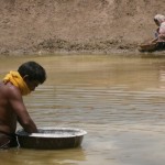 Photo of husband and wife building fish pond for fish farming