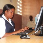 Municipal staff process tax payments on software locally developed for the Haitian context.