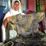 Qani Abdi Alin, the founder of Dheeman Enterprise, shows off one of her designs.