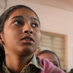 Khushiya, 13, follows along as a computer program that guides her English lessons narrates a story about a tree and its leaves.