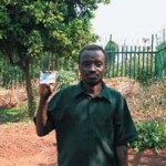 Mr. Mkandawire holding his OIBM smart card.