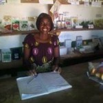 Nelia Banda taking inventory at her store in Petauke, Zambia