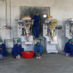 Sail Food Company workers use the new packing machines 