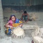 Tarango Rani crafting bamboo baskets with her husband