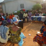 Women Sit in a Circle at a Village Savings and Loan Meeting