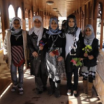 Schoolchildren on pedestrian bridge in Basra, a community project supported by USAID
