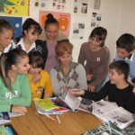 Teaching from a wheelchair at home in Tirana, Teuta Halilaj (center) inspires her students with her positive attitude.