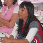 Vilma Dinora Morales, a champion of women's rights in Villa Nueva, attends a domestic violence training session.  