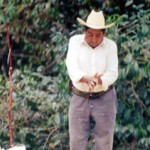 Senor C. Rogelio Vazquez studies his coffee, the sales of which support his four sons and 36 members of his extended family