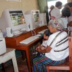 Community members use computers at the rural school in Cunén, Quiché , Guatemala.  