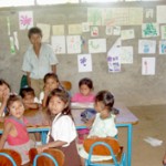 Students of the new Los Ositos Presechool, financed by increased profits from Fair Trade coffee sales, pose with their teacher