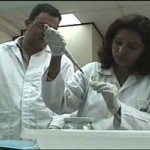 Dr. Mireya Matamoros, Director and Miguel Fortín, Analyst, at the genetics lab in the Forensic Medicine Directorate. 
