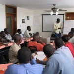 A participant makes a presentation during a portfolio management class at the National Association of Microfinance Institutions 