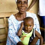 Fatta Mento is raising grandson Febyah in Lofa County Liberia and attends USAID nutrition classes in her village.