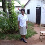 Tomasa, a local midwife, at the entrance of her house in Caaguazu. 