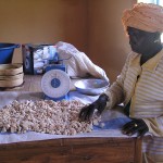 Kadiatou Ndao processes baobab fruit kernels into a powder for sale in the Senegalese capital, Dakar. A USAID-funded activity he