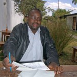 A USAID-supported incentive program is encouraging Zambian doctors such as Dr. Abel Shawa to serve in remote districts of their 