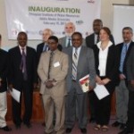 (back), U.S. Ambassador Booth, USAID Mission Director Staal, and U.S. Science Envoy Ejeta join representatives and faculty.