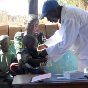 Community health workers provide check-ups for children under the LINCHPIN program.