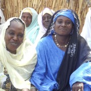 Seated among other women from the village, Madame Moringa poses for a photo in April 2012.