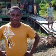 A volunteer teacher in front of the recently built Kokamu Parallel School in Dekai, Yahukimo District, Papua. 