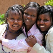 Carole Nyamoita, center, has known friends Elizabeth Njeri, left, and Cathy Magio since high school. 