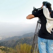 On the Road host Mujeeb Arez works on location in Paktya province, Afghanistan.