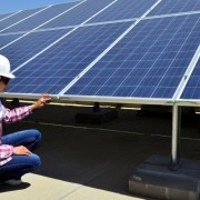 Ala Al Shareef installs solar panels on the roof of Jordan’s Ministry of Planning and International Cooperation.