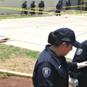  In the city of Cuernavaca, police officers participate in a field exercise to preserve and protect crime scenes, which includes