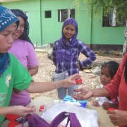Informal laboratory workers in Basilan get supply of sputum cups for distribution to community members with TB symptoms.