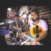 Jalal Molla with his solar lights and sewing machine