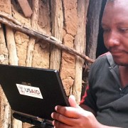 A USAID-trained enumerator uses a tablet to collect information for a Feed the Future baseline survey.