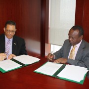 U.S. Ambassador to the AU Michael Battle and African Union Commission Deputy Chairperson Erastus Mwencha renew the agreement