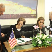 USAID Mission Director Sherry F. Carlin and Ministry of International Cooperation Sahar Nasr sign a bilateral agreement.