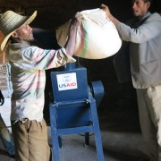 Workers demonstrate how the livestock grinder works. The equipment was provided to Ethio-Feed through a USAID grant.