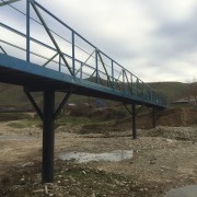 The new bridge will improve daily communication and school attendance for more than 40 families in the Surra community.